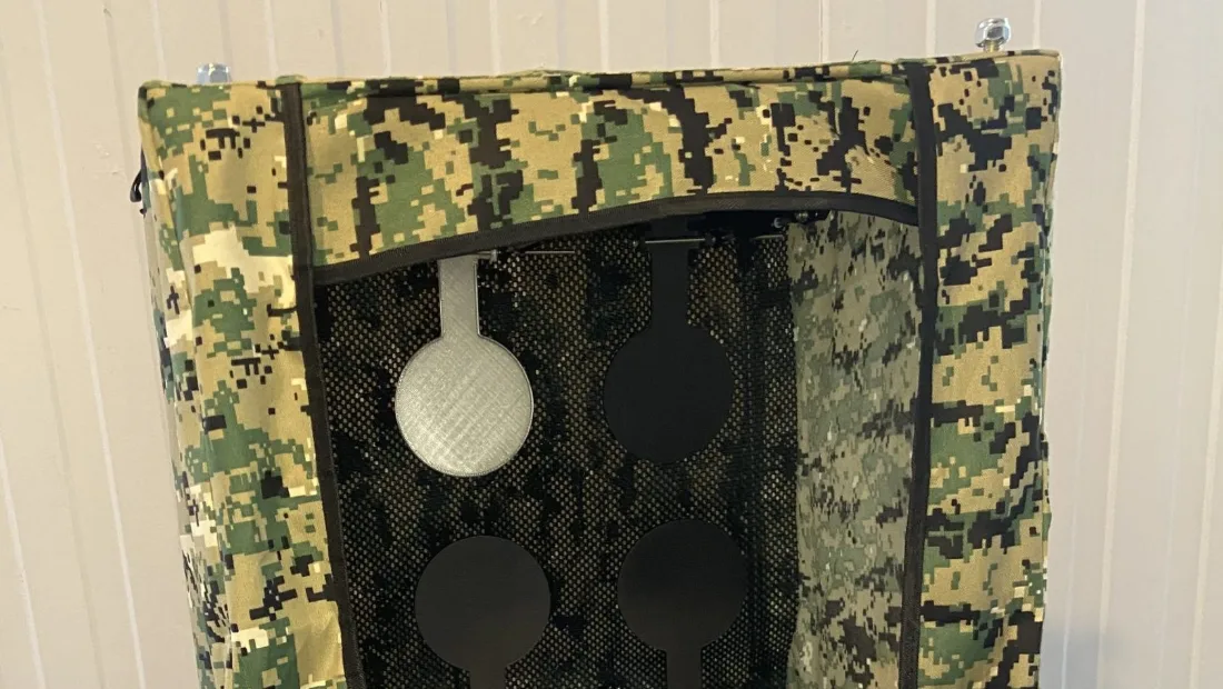 Smart airsoft shooting target prototype in a camouflage catch box